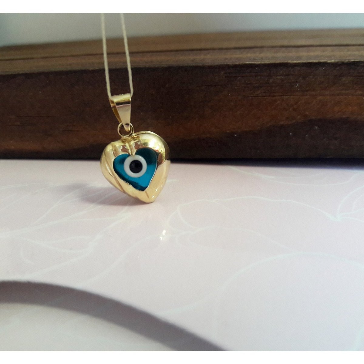 Золотой кулон от сглаза